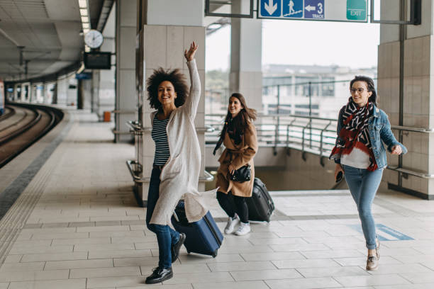 istock Young woman trying to catch the train 1133821794