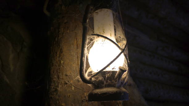 istock Dirt dust and cobwebs on the lighted lamp 1133822128