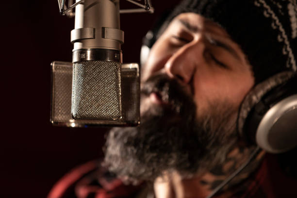istock Male singer performing for recording in sound studio 1133822313