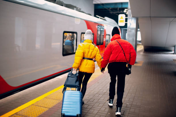 istock Young females running railway train. 1133822489