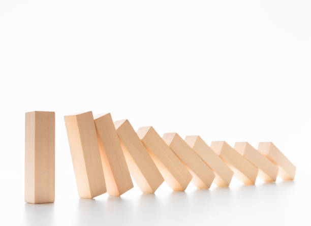 istock Domino effect stopped by one strong piece 1133824033
