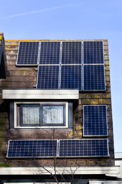 istock Shadow of a tree on solar panels on a roof 1133824260