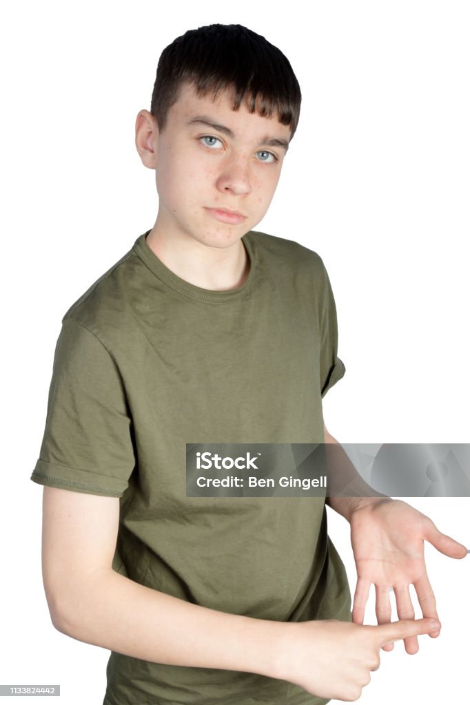 British Sign Language Caucasian teenage boy doing British Sign Language showing the symbol for E British Sign Language Stock Photo