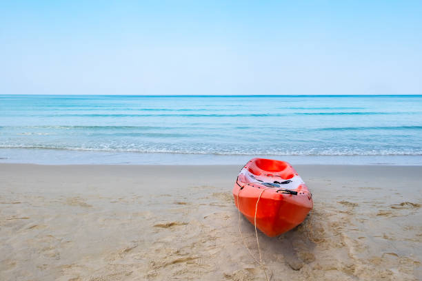 istock Kayak on the beach with blue sky 1133824539