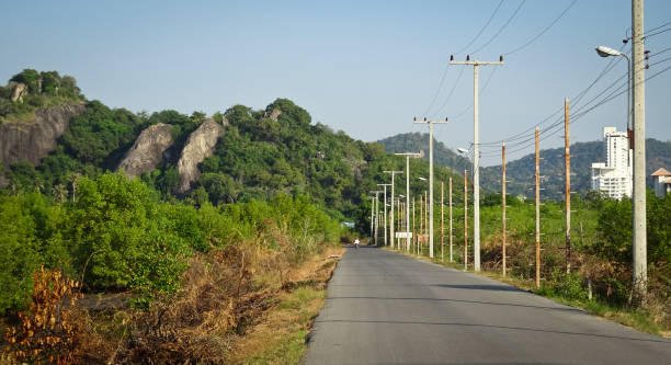 istock A picturesque asphalt road among low mountains. 1133825927