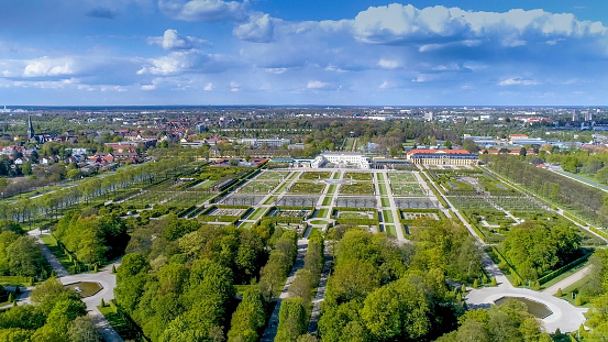 The wide aerial shot of the Herrenhausen Gardens. The Herrenhausen Gardens located in Herrenhausen an urban district of Lower Saxonys capital of Hanover are made up of the Great Garden the Berggarten the Georgengarten and the Welfengarten.