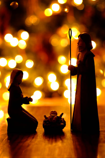 Closeup of Nativity with Christmas lights out of focus for the true meaning of Christian Holiday Closeup of Nativity with Christmas lights out of focus for the true meaning of Christian Holiday nativity scene photos stock pictures, royalty-free photos & images