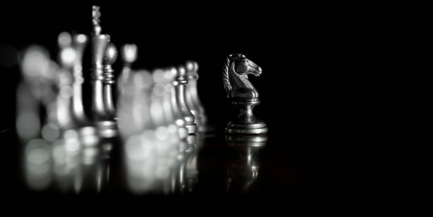 istock Pieces on chess board for playing game and strategy knight kingdom gaming 1133827555