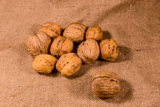 istock Heap of the walnuts on a sackcloth 1133828730