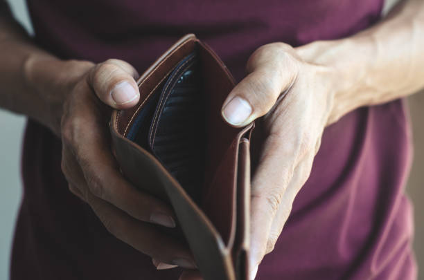istock hipster man open show wallet with empty of money. financial poverty payment problem concept. 1133829320