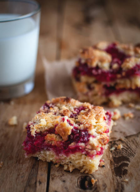 istock Close-up of raspberry crumb bar on wooden background 1133832700