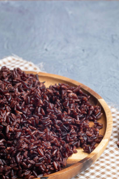 istock close up riceberry rice on wooden plate 1133832836