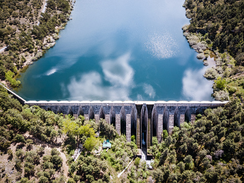 Aerial view of Hydroelectric Dam with lots of water behind