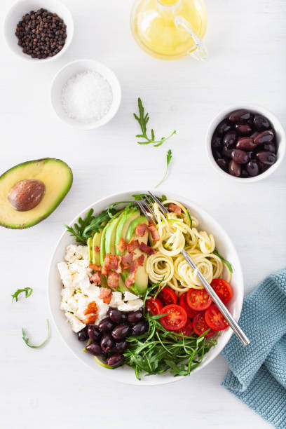 istock ketogenic lunch bowl: spiralized courgette with avocado, tomato, feta cheese, olives, bacon 1133832954