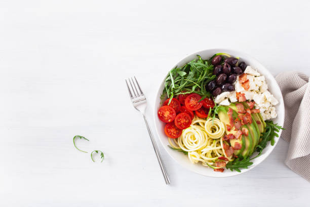 istock ketogenic lunch bowl: spiralized courgette with avocado, tomato, feta cheese, olives, bacon 1133832986