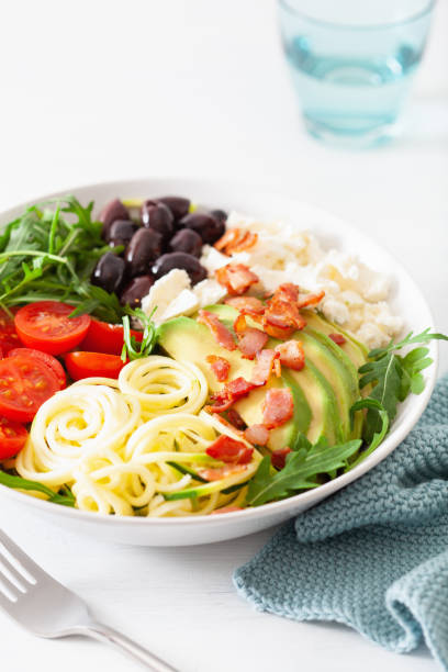 istock ketogenic lunch bowl: spiralized courgette with avocado, tomato, feta cheese, olives, bacon 1133833586
