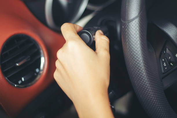istock asian Woman 's hands Push button Turn Signal, button the car,selective focus on hand 1133834080