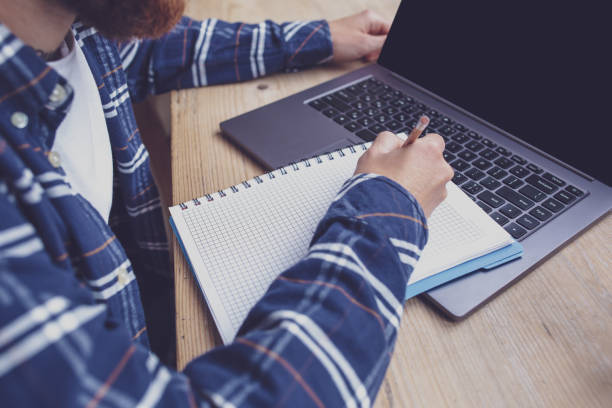 istock Casual business man or freelancer planning his work on notebook, 1133834295