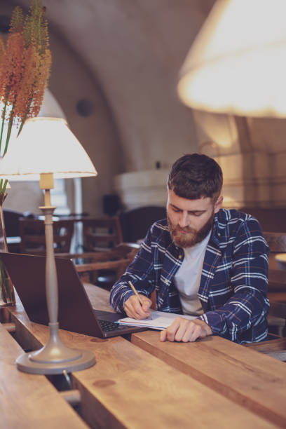 istock Casual business man or freelancer planning his work on notebook, 1133834319