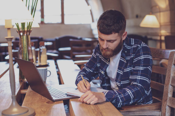 istock Casual business man or freelancer planning his work on notebook, 1133834320
