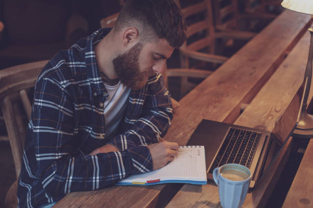 istock Casual business man or freelancer planning his work on notebook, 1133834429