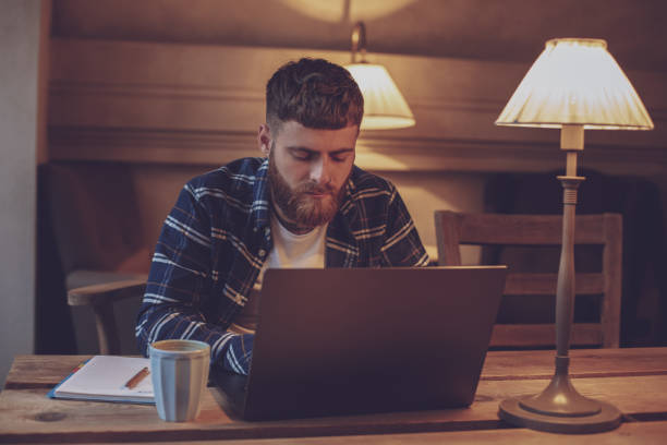 istock Young professional surfing the Internet on his laptop in a cafe 1133834443