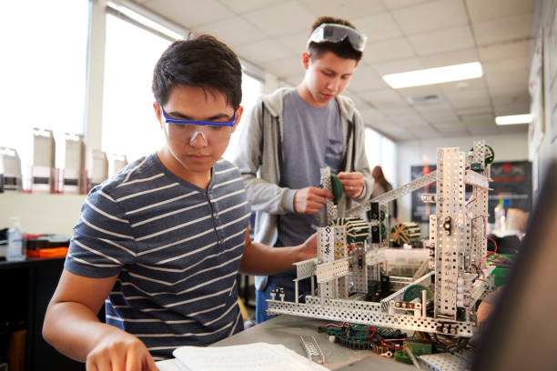 istock Two Male College Students Building Machine In Science Robotics Or Engineering Class 1133836075