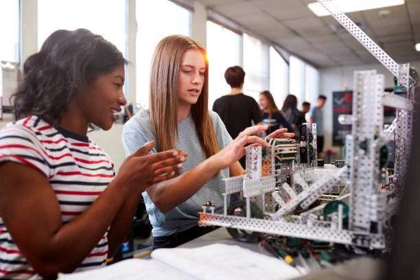 istock Two Female College Students Building Machine In Science Robotics Or Engineering Class 1133836307