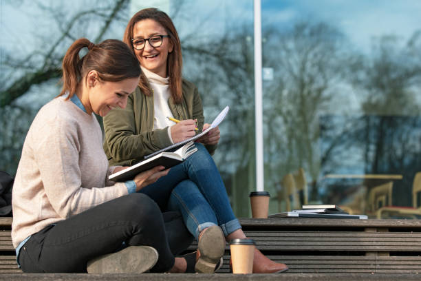 Two women studying in the city