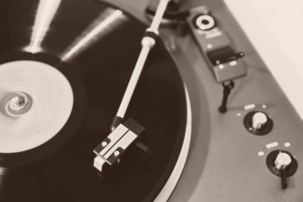 istock Turntable vinyl record player. Retro audio equipment for disc jockey. Sound technology for DJ to mix & play music. Black vinyl record. Vintage vinyl record player 1133836607