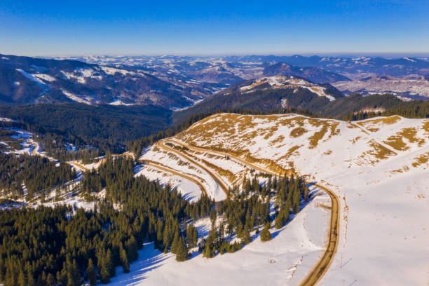 istock Winter curvy road in Rarau mountains 1133836610