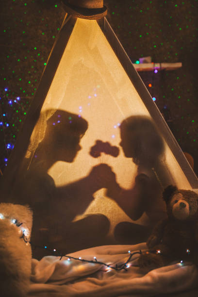 istock Happy kids having party in tent 1133840509