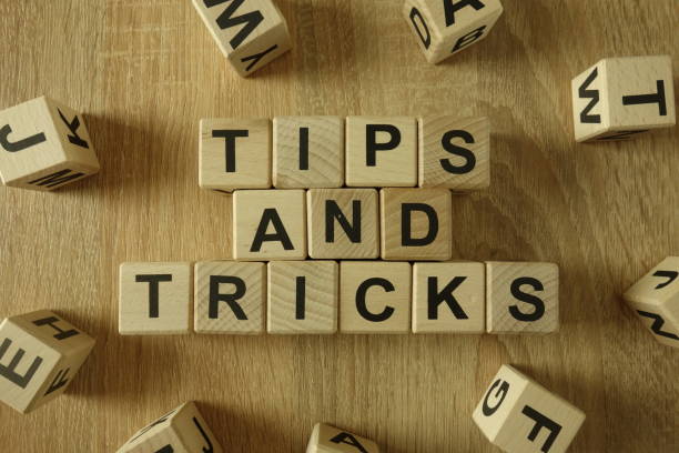 Tips and tricks text Tips and tricks text from wooden blocks on desk magic trick stock pictures, royalty-free photos & images