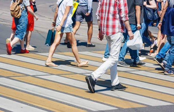 istock pedestrians at a pedestrian crossing 1133843882