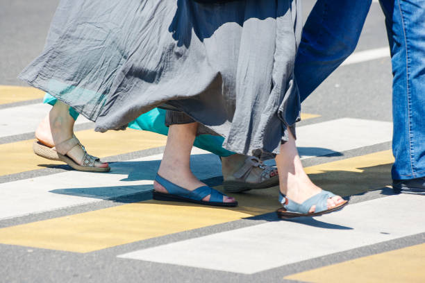 istock pedestrians at a pedestrian crossing 1133843952
