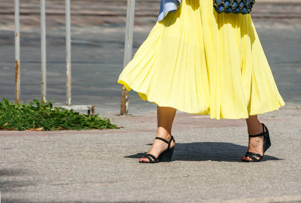 istock young woman walking down the street 1133844109
