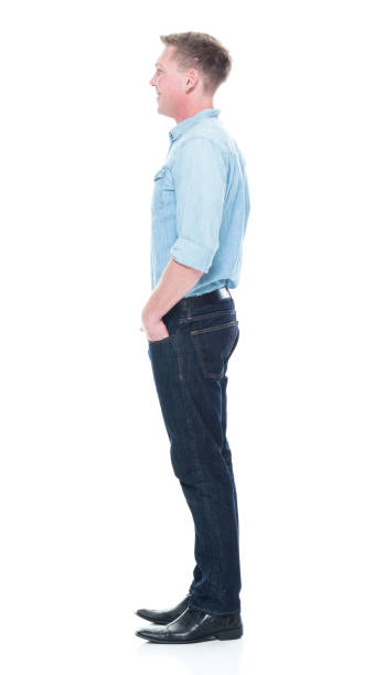 istock Handsome man standing with hand in pockets 1133844153
