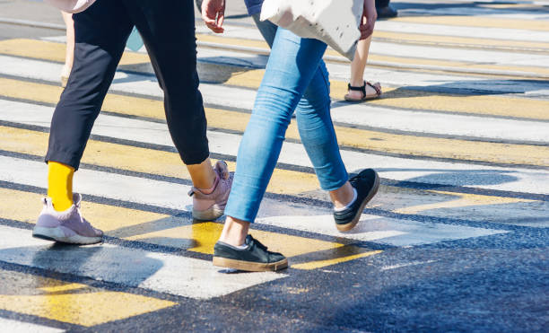 istock pedestrians at a pedestrian crossing 1133844154
