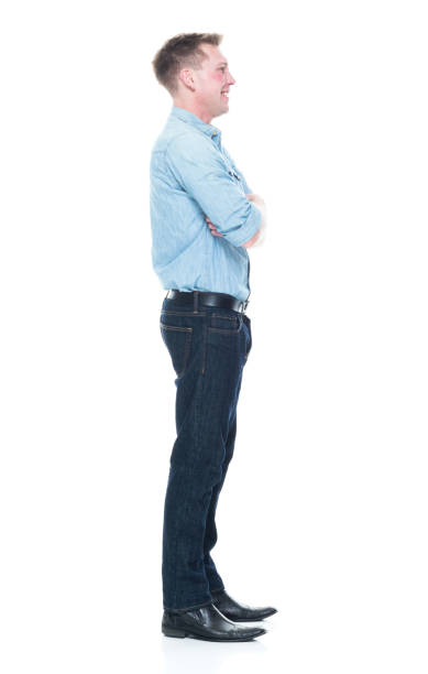 istock Handsome man standing with hands crossed 1133844248