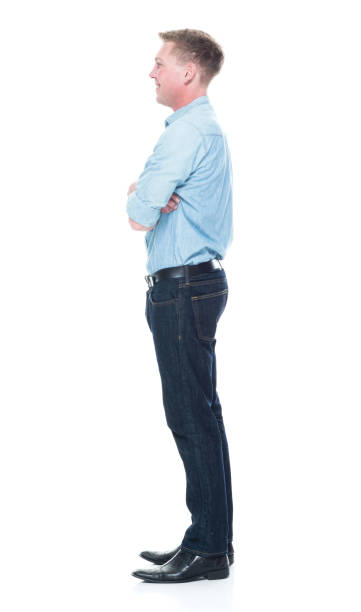 istock Handsome man standing with hands crossed 1133844257