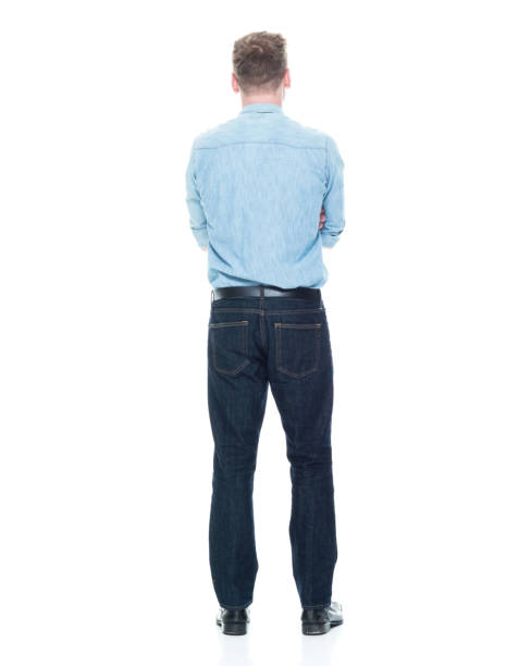 istock Handsome man standing with hands crossed 1133844261