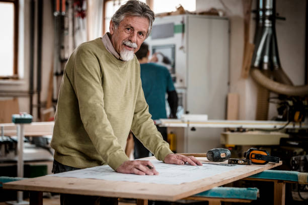 istock Portrait of an elderly man in a carpenter's workshop 1133844433