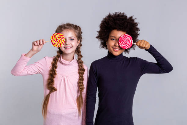 istock Smiling beaming kids wearing turtlenecks while making photos 1133845525