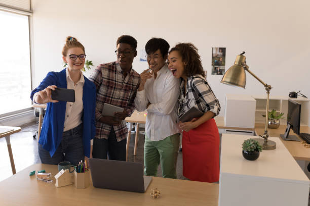 istock Business people taking selfie with mobile phone 1133845752