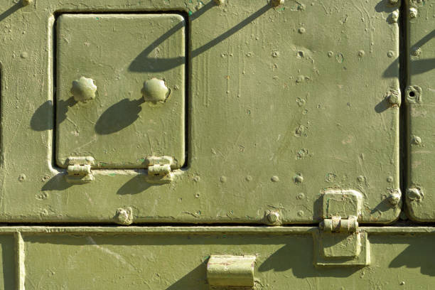 istock iron manhole military green machine with rust 1133845782