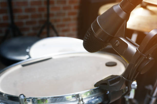 istock Close up of microphone and drum at the stage. 1133849969