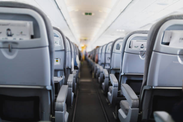 istock airline passenger seats and aisle 1133849978