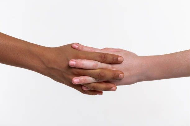 istock Two hands of little children connected together 1133850751