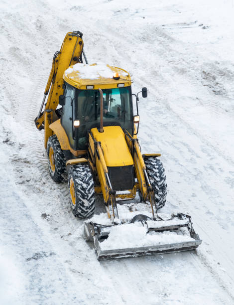 istock Tractor shoveling snow on the street. 1133851460