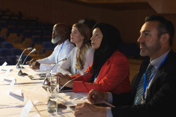 istock Business executive looking and listening while sitting in the auditorium 1133854709